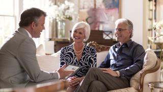 financial advisor consulting with a couple