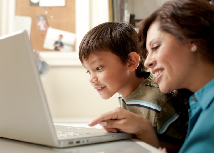 mom and son at laptop