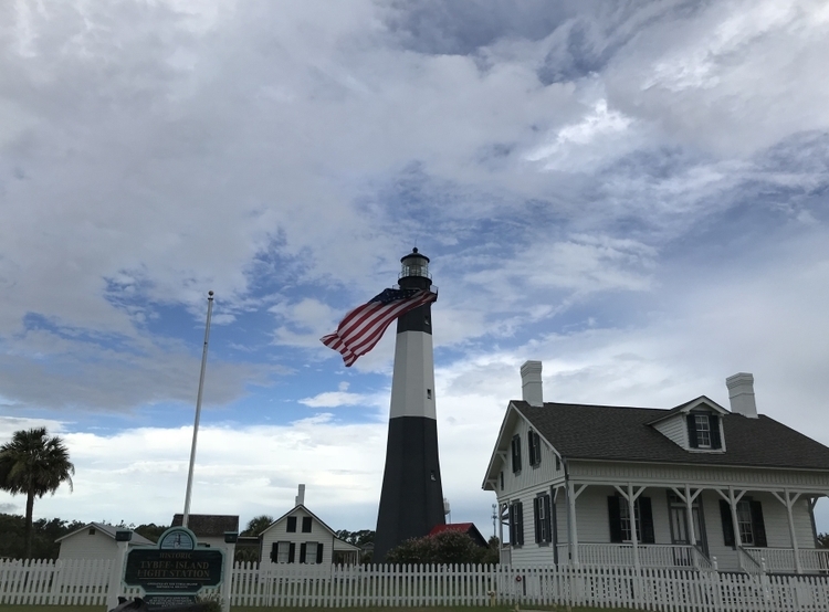 American flag hanging from lighthouse on Tybee Island