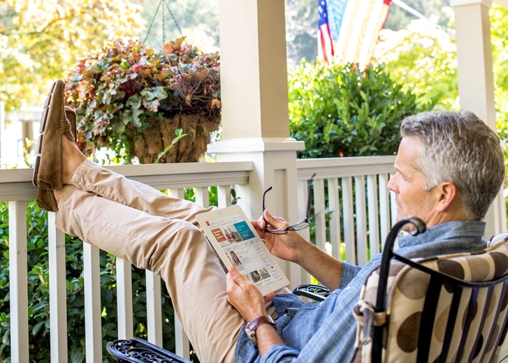 man on porch reading