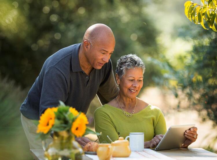 Couple reviewing information on tablet