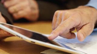 people working on a tablet