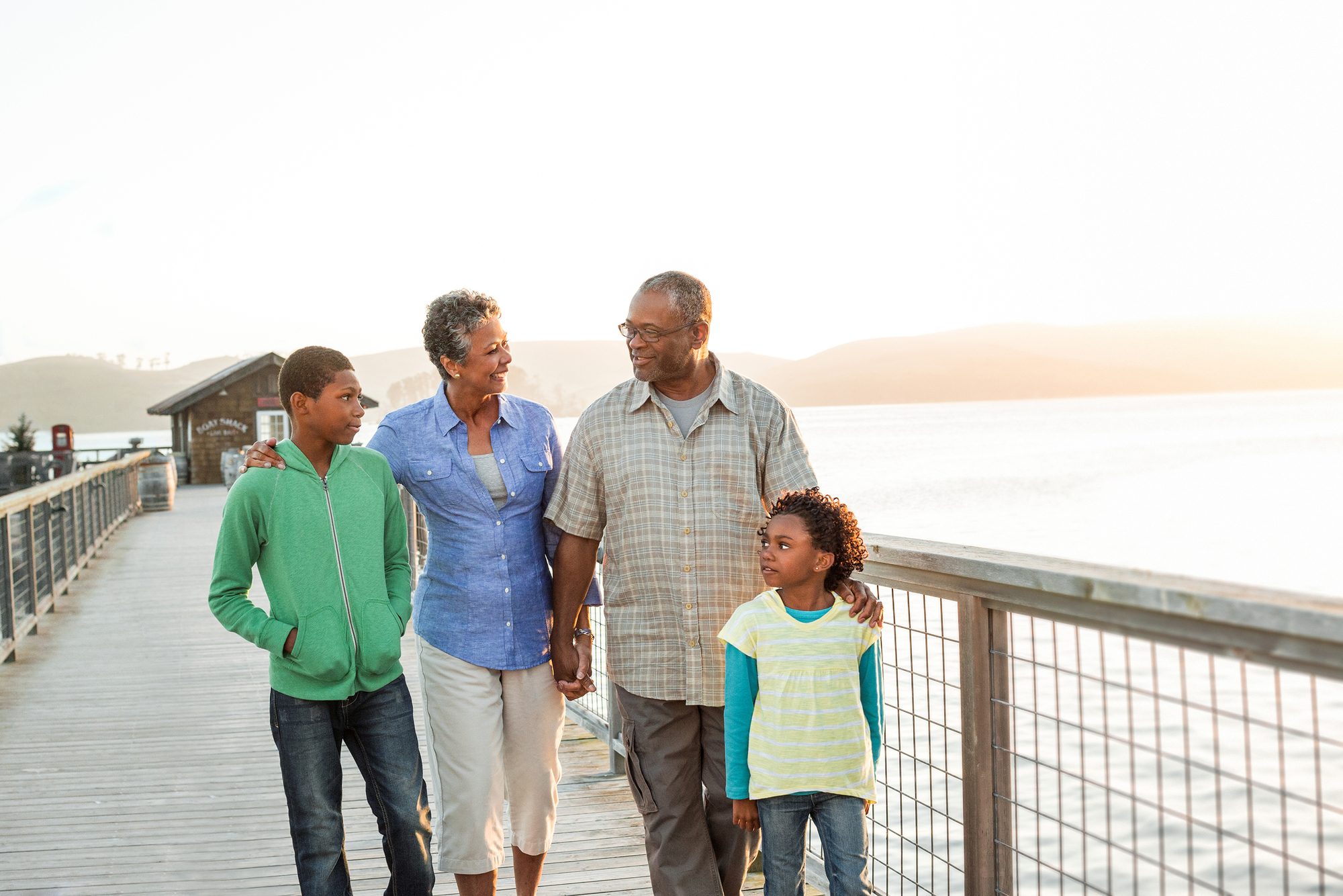 grandparents with kids on a pier