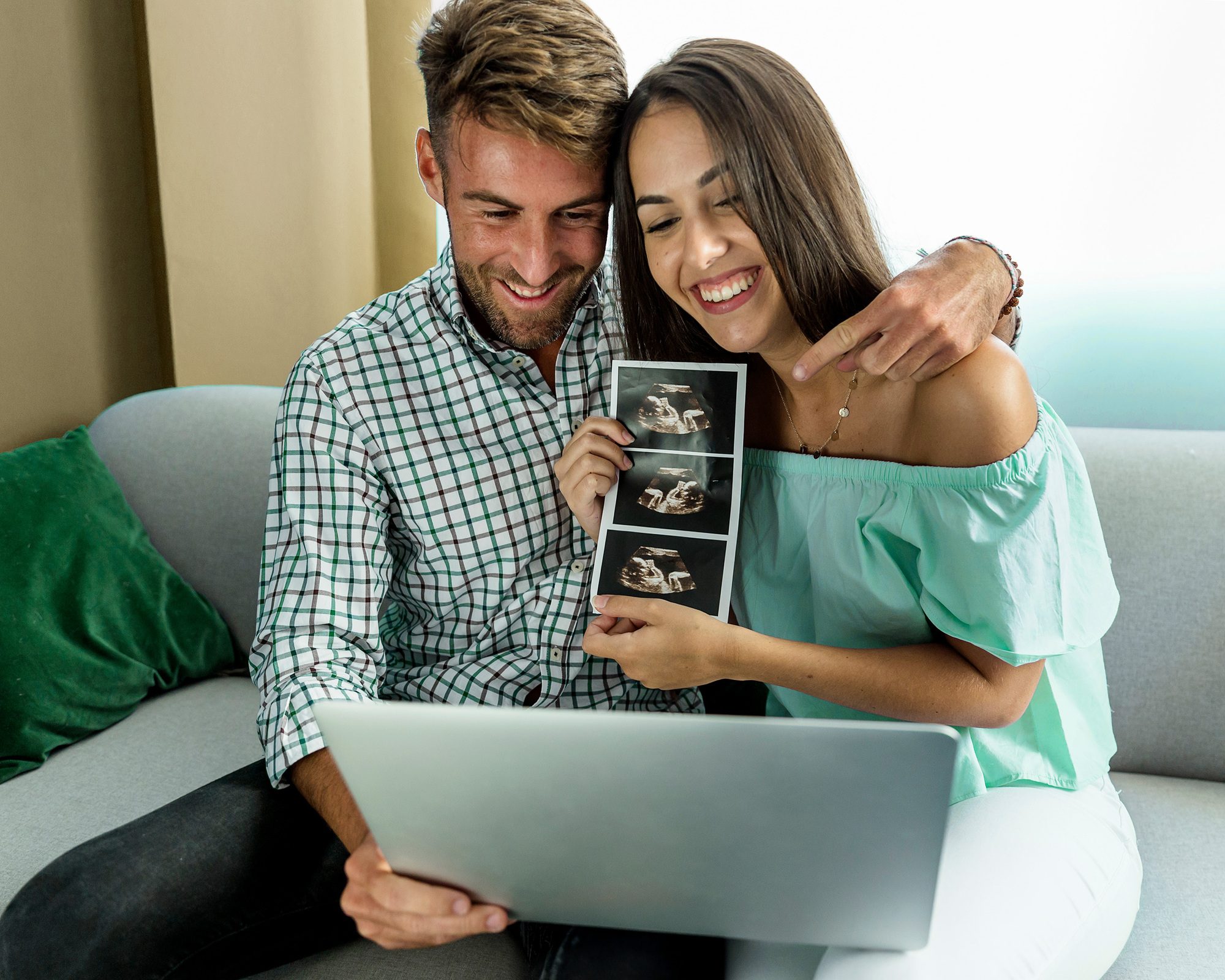 young couple excited about sonogram