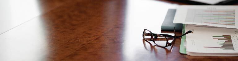 glasses and papers on a desk