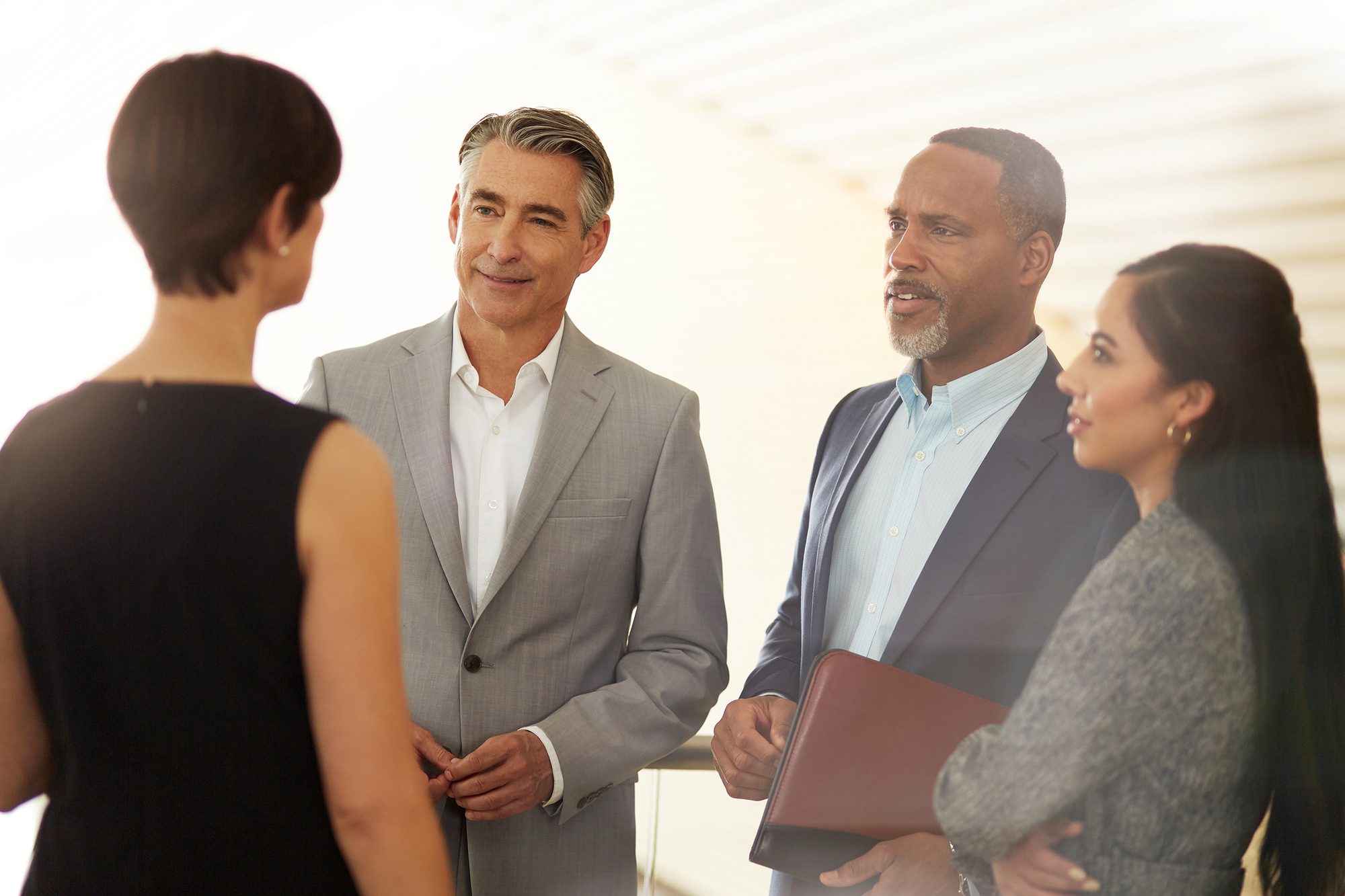 several business individuals talking