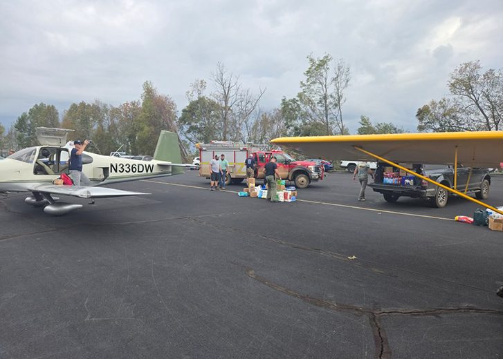 runway with planes and donations with volunteers
