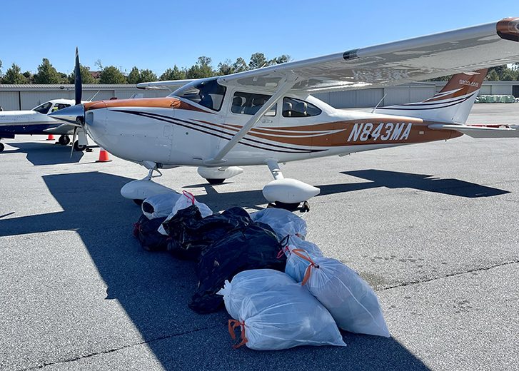 plane on runway with donations