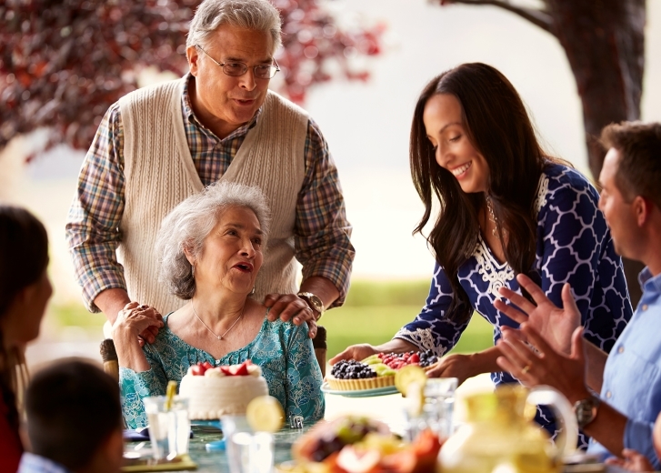 multi-gen family at the dinner table celebrating