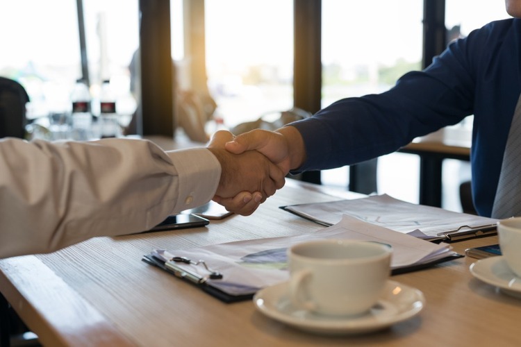 coffee cup handshake