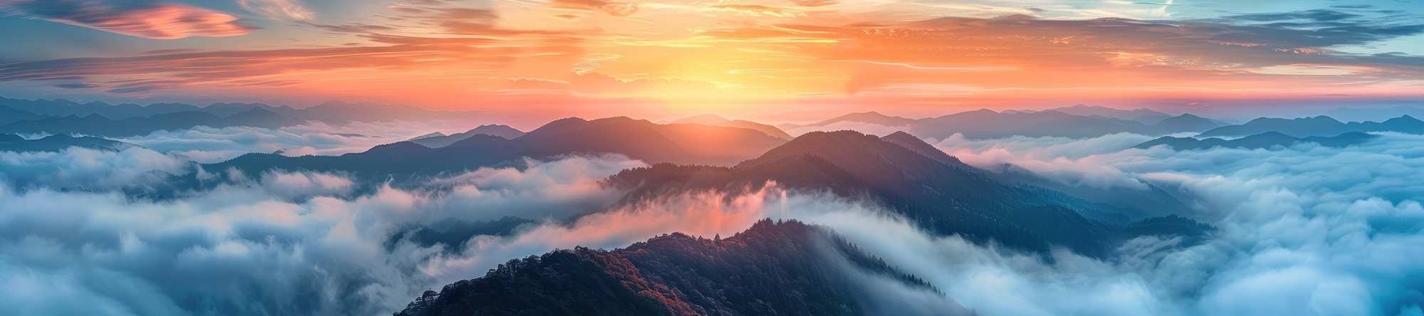 Mountains rising above clouds