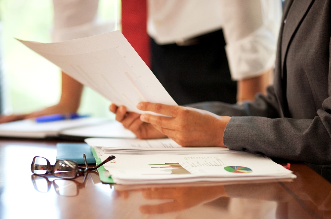 business hands looking over paperwork