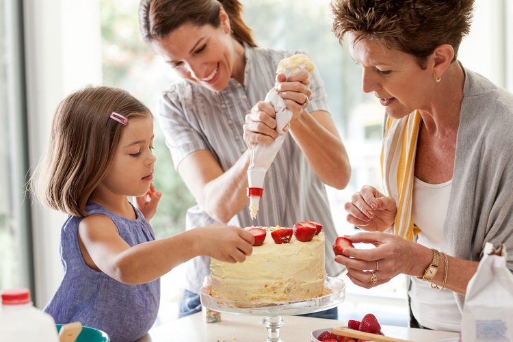 grandmother, daughter and child baking