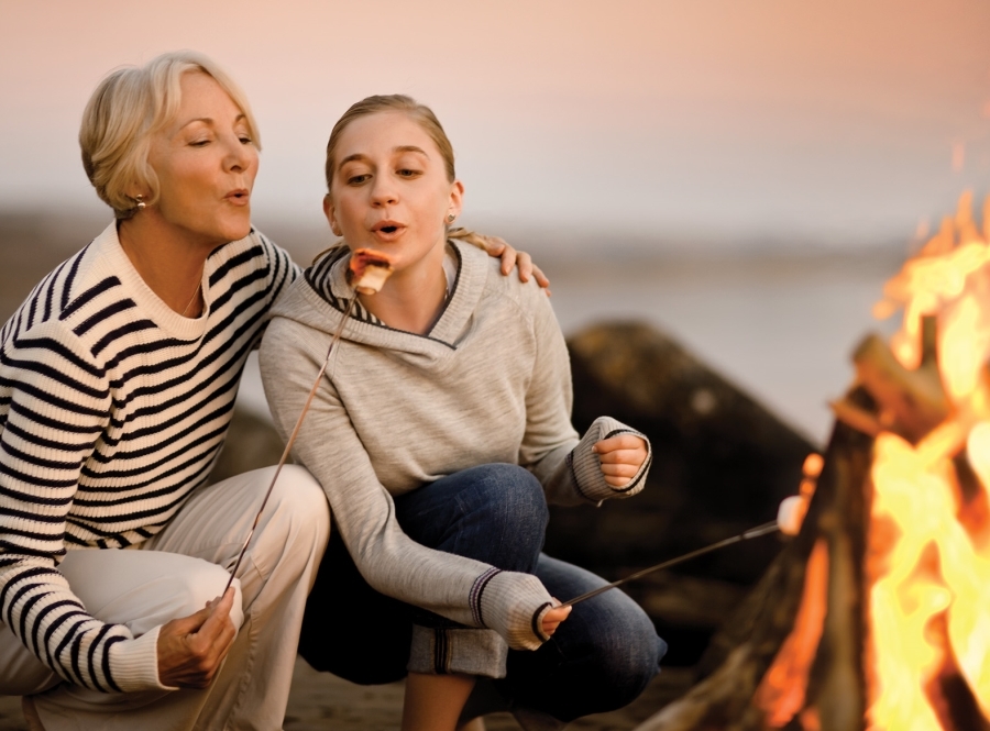 Mom and daughter at campfire