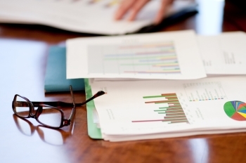 desk with papers and charts