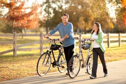 middle age couple riding bikes