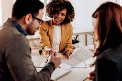 people looking over paperwork