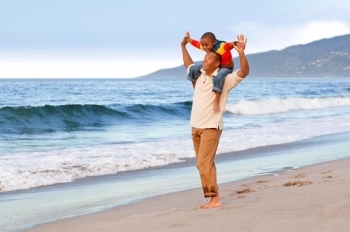 Man and son on beach