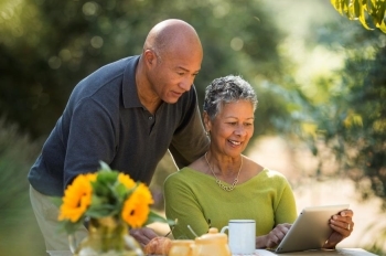 Couple reviewing information on tablet