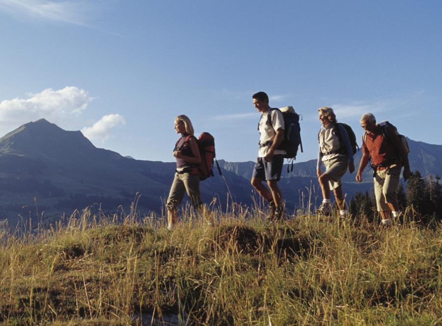 people hiking in mountains