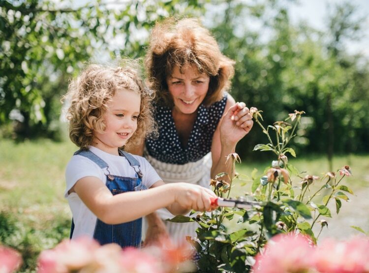 woman with young child in garden