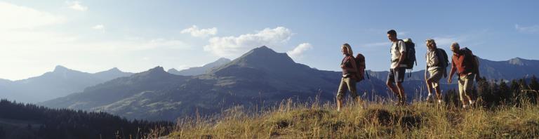 people hiking in the mountains