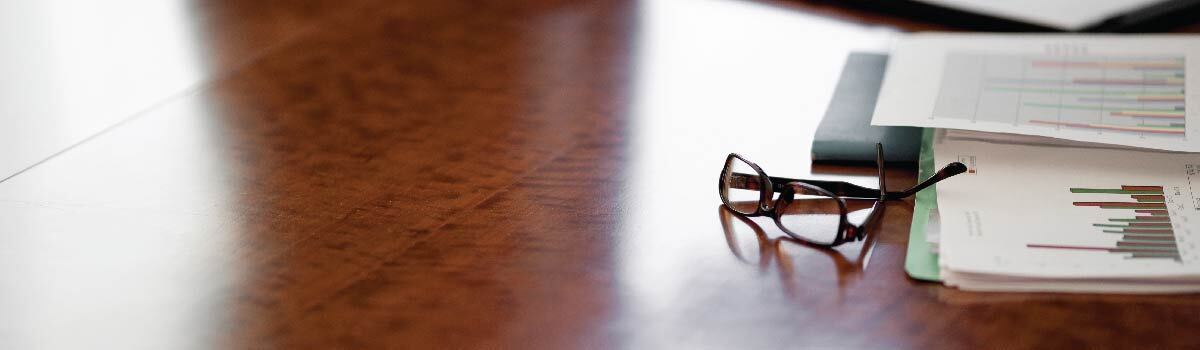 glasses and papers on a desk