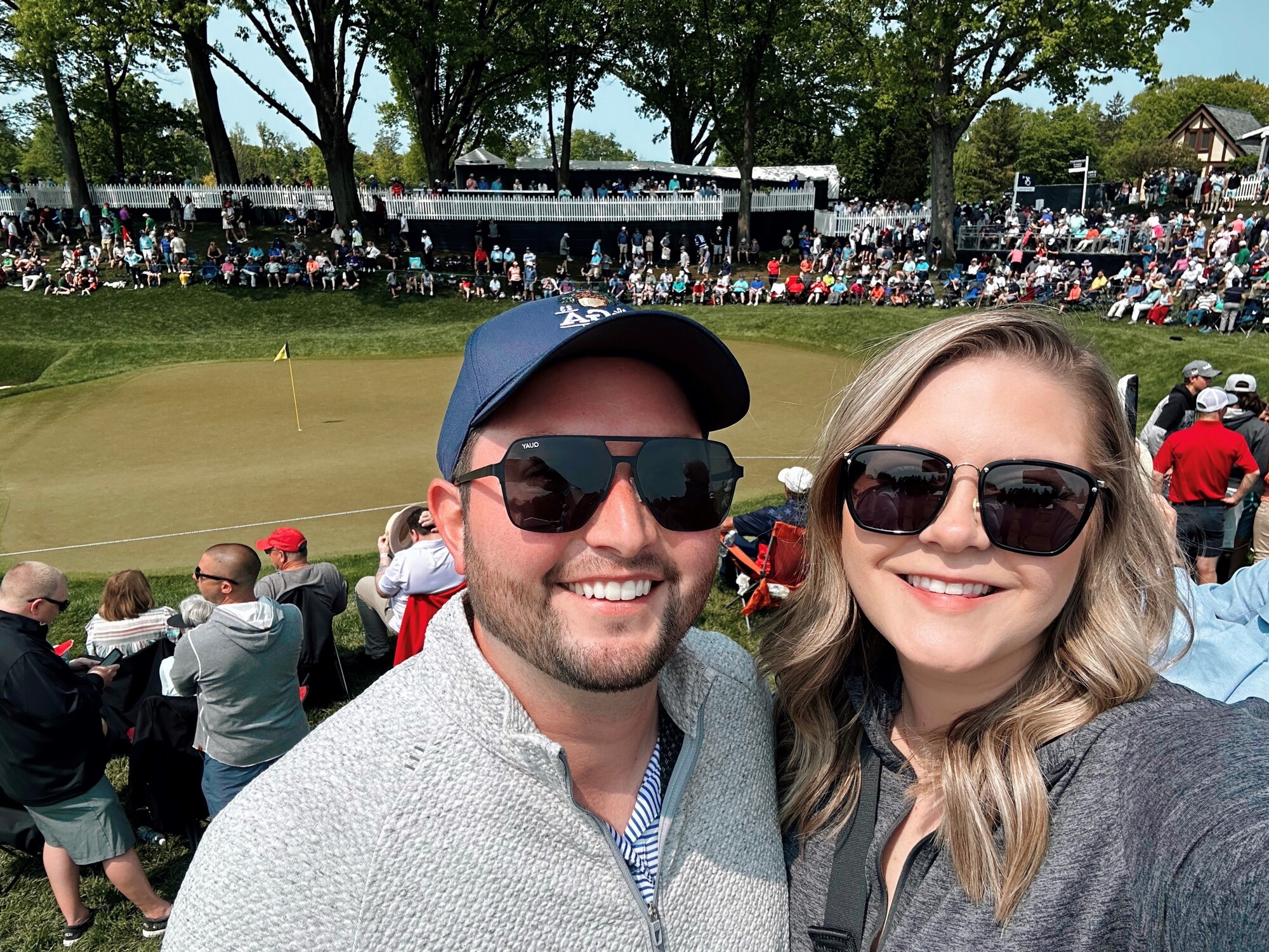 Taylor and her husband Parker at the PGA Championship in Rochester NY