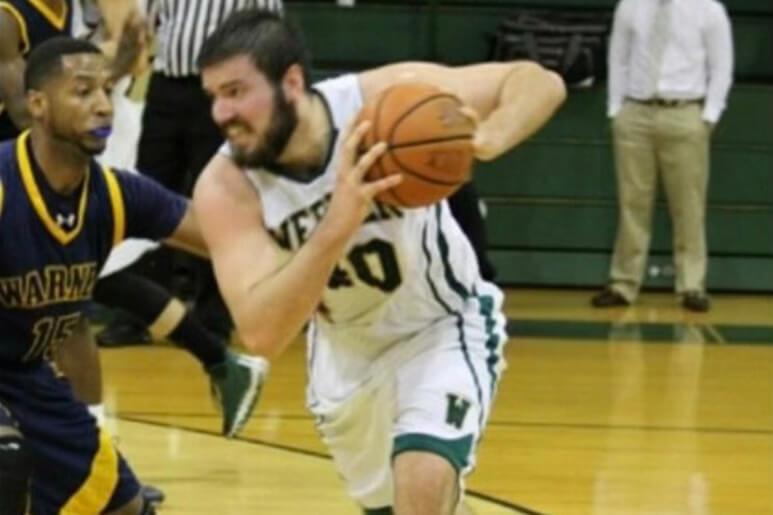 Sean playing basketball for Webber International University