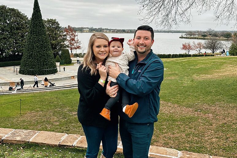 Taylor, her husband Parker and daughter Peyton at the Dallas Arboretum during Christmas