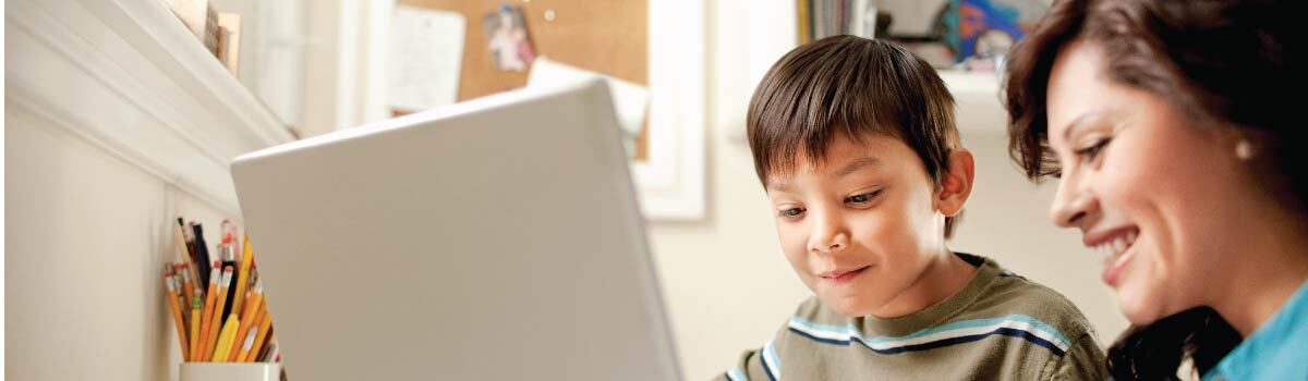 mom and son working on a computer